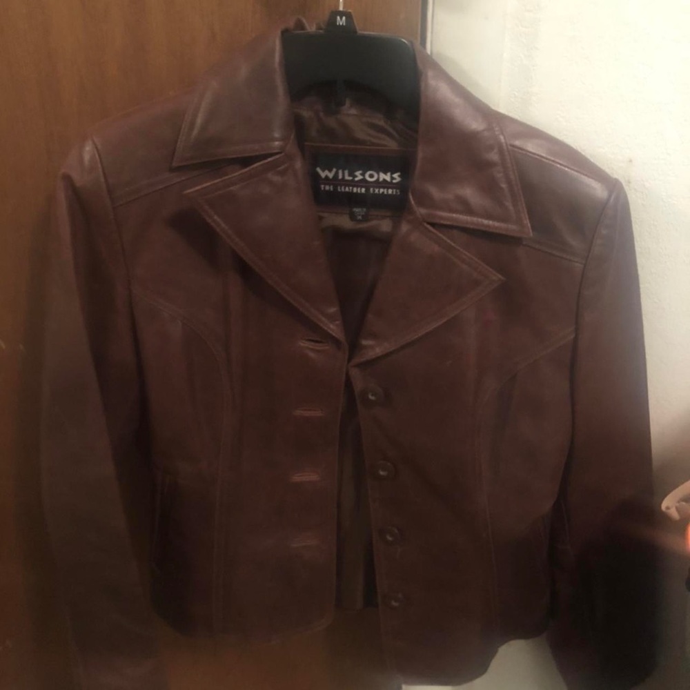 Wilson’s brown leather jacket